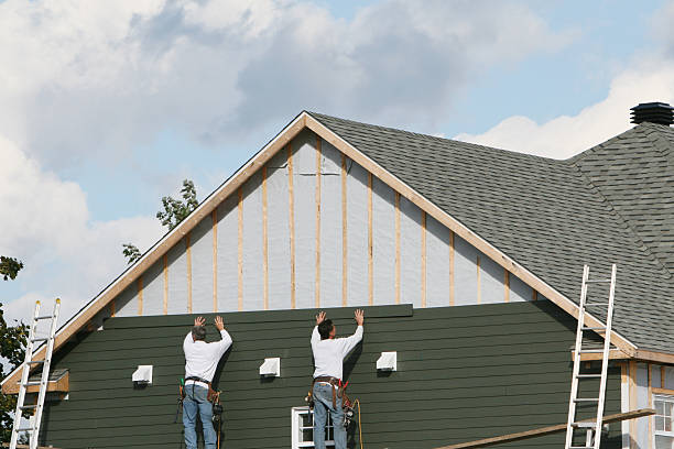Professional Vinyl Siding technician working in Terryville, NY